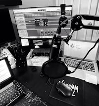 a black and white photo of a desk with a microphone