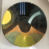 a plate with a black and yellow design on it