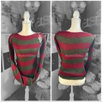 a mannequin wearing a red and green sweater