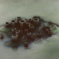 a group of black cylinders in the water
