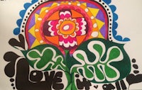 a drawing of a flower with the words love is all