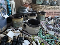 mugs and beads on a table