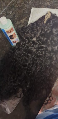 a painting of a curly wig on a table