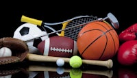 a group of sports equipment on a black background