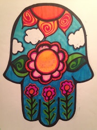 a drawing of a hamsa with flowers and a sun