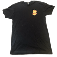 a black t - shirt with a flaming head on it