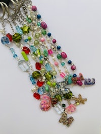 a colorful collection of beads and charms on a chain