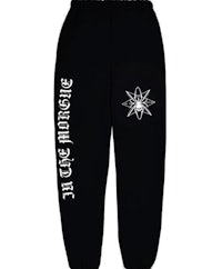 a black sweatpants with an image of a spider on it