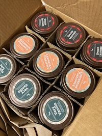 a box with several jars of different flavors