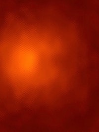 an orange background with a bright light in the middle
