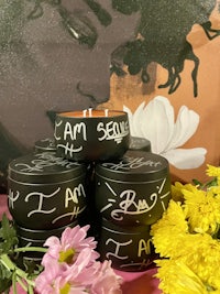 a group of black jars with the words i am sean on them