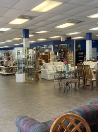 the inside of a furniture store with a lot of furniture
