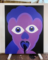 a painting with a purple face on it