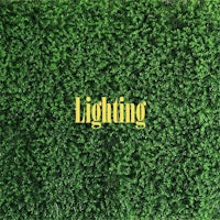 a green wall with the word lighting on it
