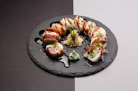 japanese sushi on a black plate