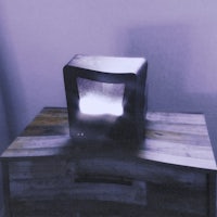 a tv sitting on top of a wooden table