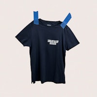 a t - shirt with a blue ribbon hanging on it