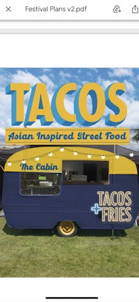 a photo of a taco truck with the words tacos on it