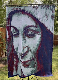 a painting of a woman with a hat on a stand