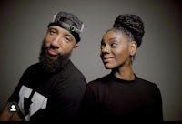 a man and woman with a beard are posing for a photo