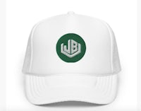 a white hat with a green logo on it