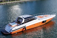 an orange and white motor boat is floating in the water