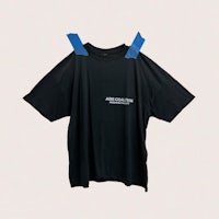 a black t - shirt with blue tape on it