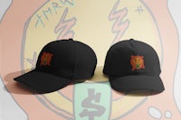 two black hats with a logo on them