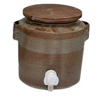 a brown ceramic water jug with a lid
