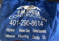 a blue shirt with the words pm soua construction on it