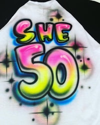 a t - shirt with the words she 50 on it