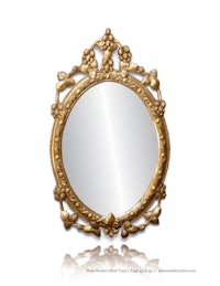 an ornate gold mirror on a white background