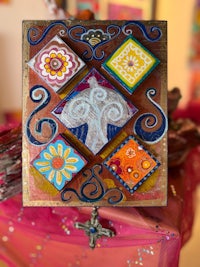 a wooden frame with colorful designs on it