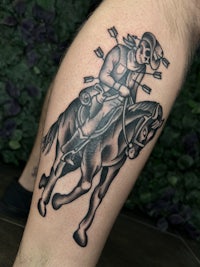 a tattoo of a skeleton riding a horse