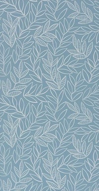a blue wallpaper with white leaves on it