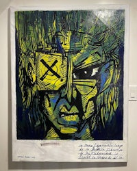 a painting of a man with a yellow and blue face