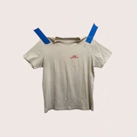 a t - shirt with blue tape on it