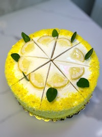 a yellow cake with lemon slices on top