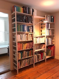 a room with a lot of books on shelves