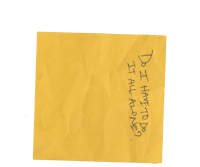 a yellow post it note with writing on it