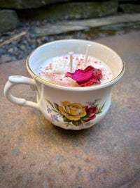 a cup of tea with roses in it