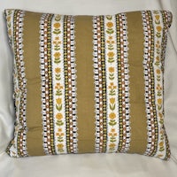 a pillow with a yellow and brown stripe on it