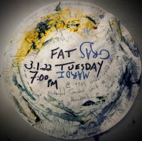 a plate with writing on it that says fat tuesday