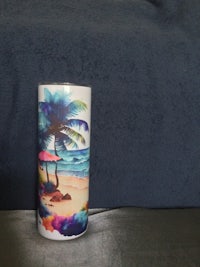 a coffee mug with a palm tree on it