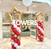 two balloon towers with the word towers on them