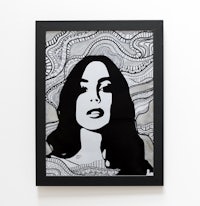 a black and white framed print of a woman's face