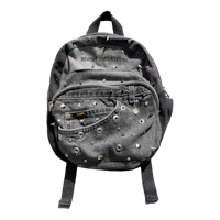 a black backpack with studs on it