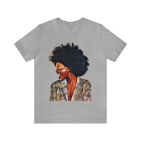 a woman with afro hair wearing a grey t - shirt