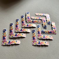 a group of colorful flower shaped stickers on a table