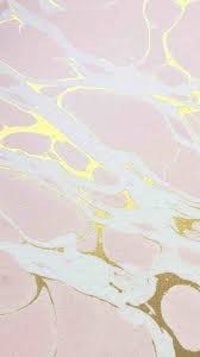 a marble floor with gold and pink paint on it